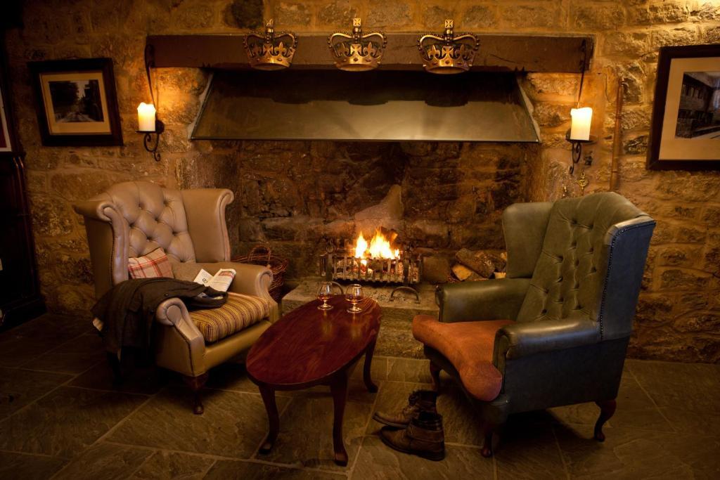 The Three Crowns Hotel Chagford Bagian luar foto The fireplace in the bar